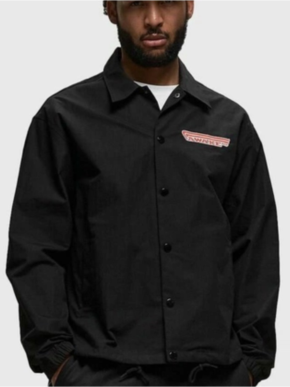 Awake Black Coach Jacket with Red Logo Patch